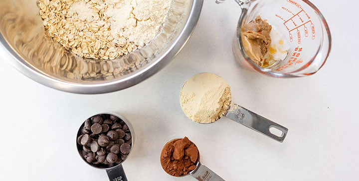 ingredients for no bake peanut butter oatmeal cookies in various measuring containers