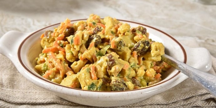 paleo chicken salad curried salad served on a white bowl 