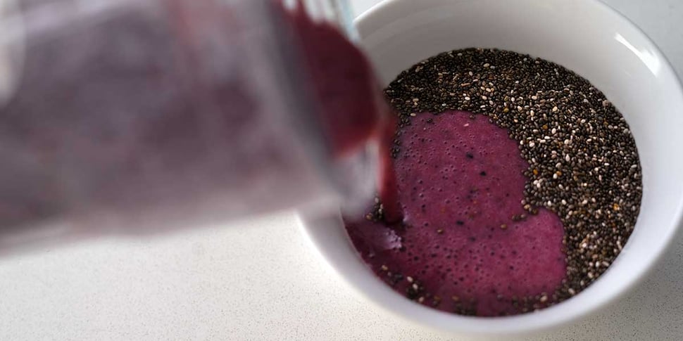 pouring liquid into chia seed pudding recipe