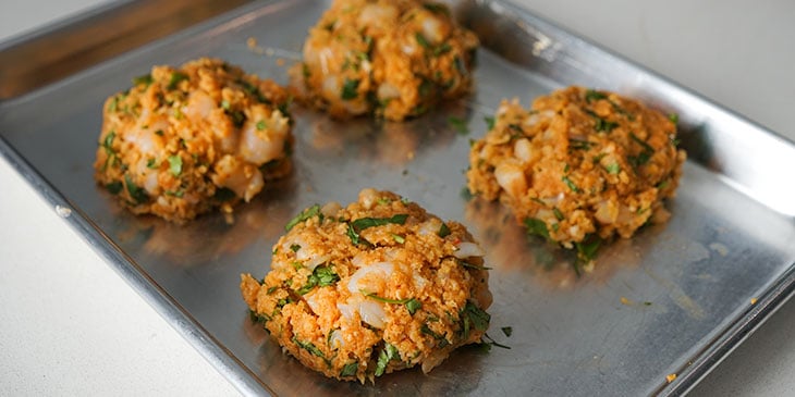 shrimp burger patties on sheet tray 