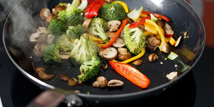 stir frying vegan pad thai for meal prep 